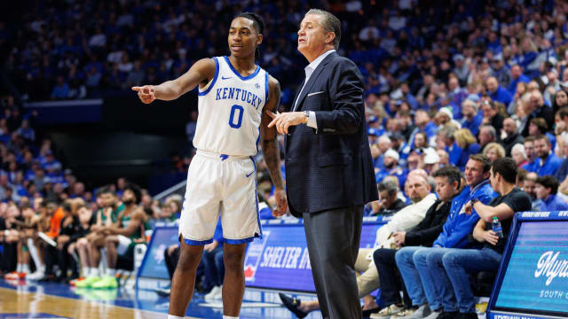 Nov 28, 2023; Lexington, Kentucky, USA; Kentucky Wildcats guard Rob Dillingham (0) talks with head coach John Calipari during the first half against the Miami (Fl) Hurricanes at Rupp Arena at Central Bank Center. Mandatory Credit: Jordan Prather-USA TODAY Sports